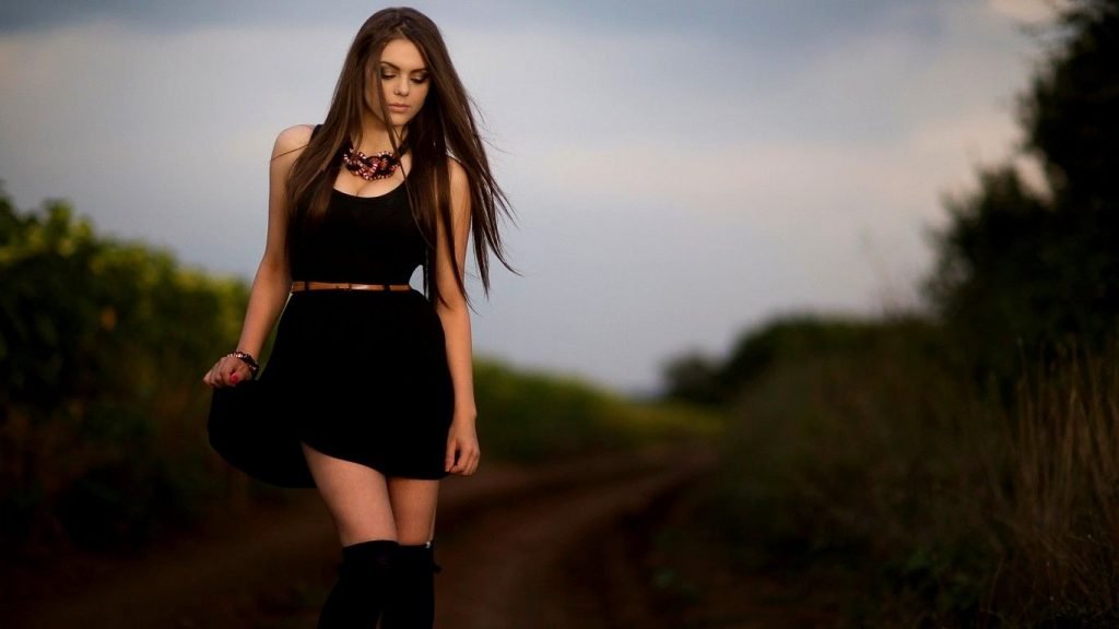 a girl with dark color dress