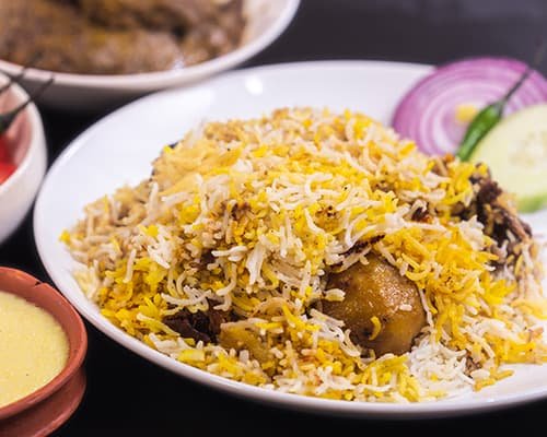 Kolkata Biriyani is mainly famous for its extraordinary flavors which you can relish with onions, raita and even other preparations of chicken. Biriyani here does not particularly require any gravy but you can also order any chicken or mutton preparation that will go with it