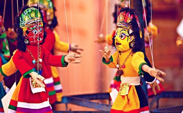 Indian Puppetry or Kathputli is a string puppet theatre, native to Rajasthan, India, and is the most popular form of traditional Indian arts. Being a string marionette, it is controlled by a single string that passes it from the top of the puppet over the puppeteers.