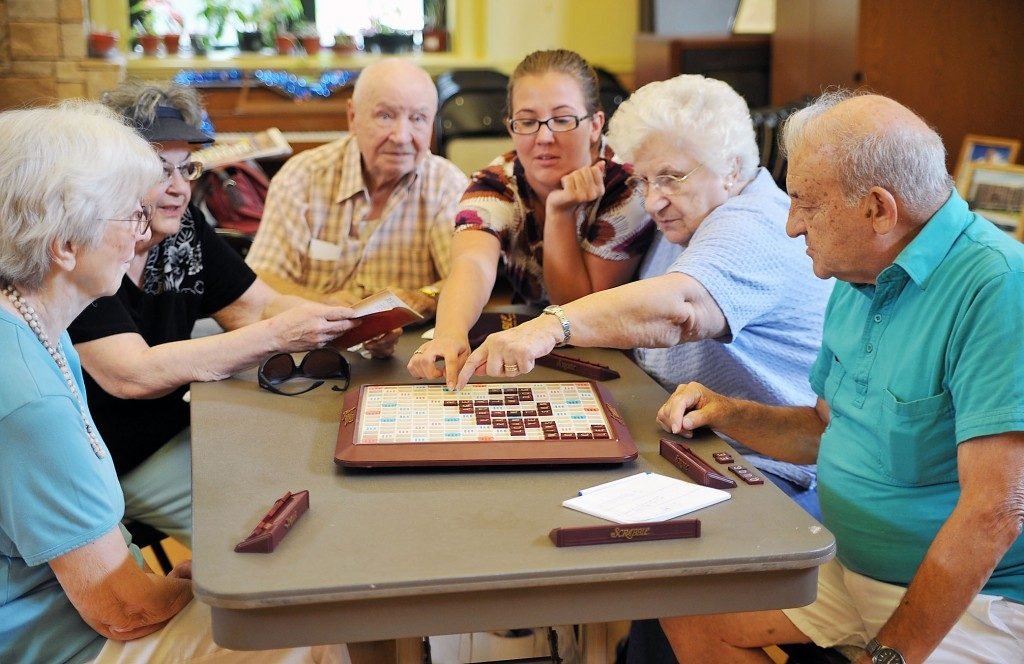 Old aged group playing board game