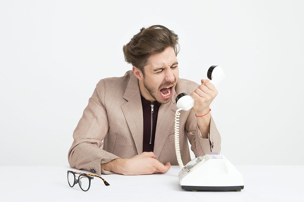 man shouting on call